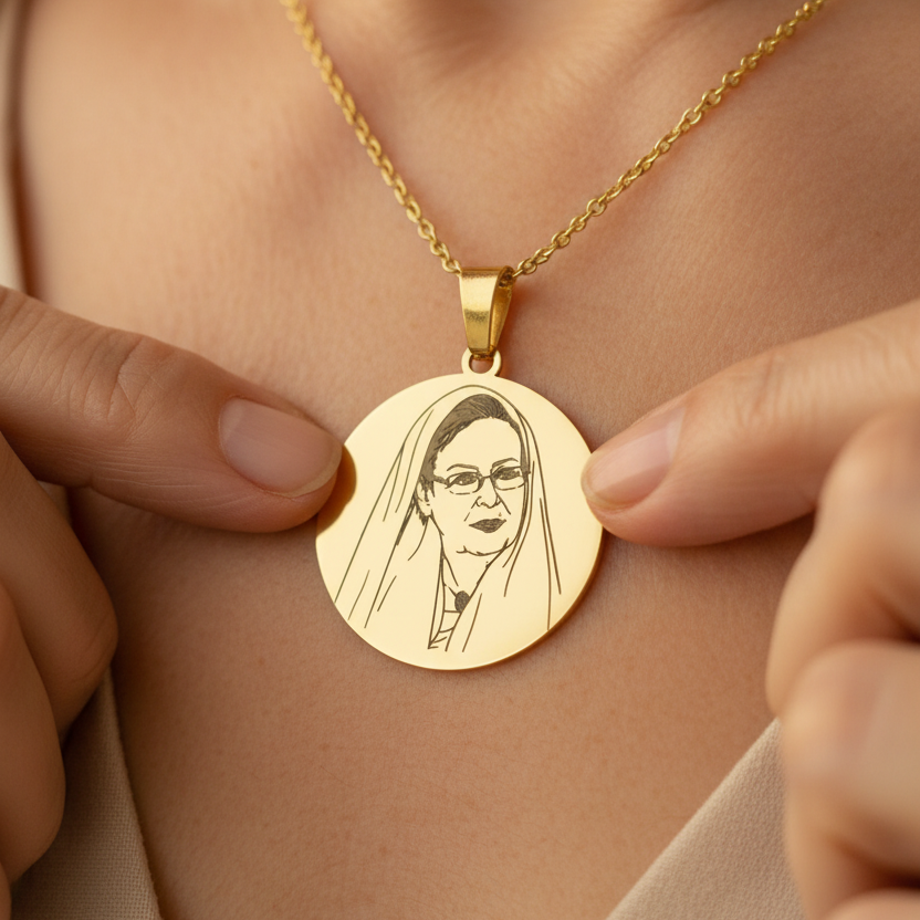 gold-older-woman-hijab-pendant-on-model_6c7a4713-67e6-4ba8-aaa0-d7a2865b9f0b.png